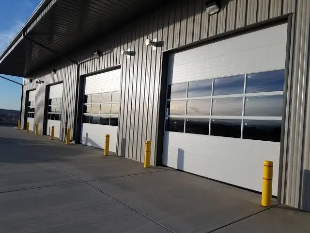 Commercial warehouse building with large garage and overhead doors